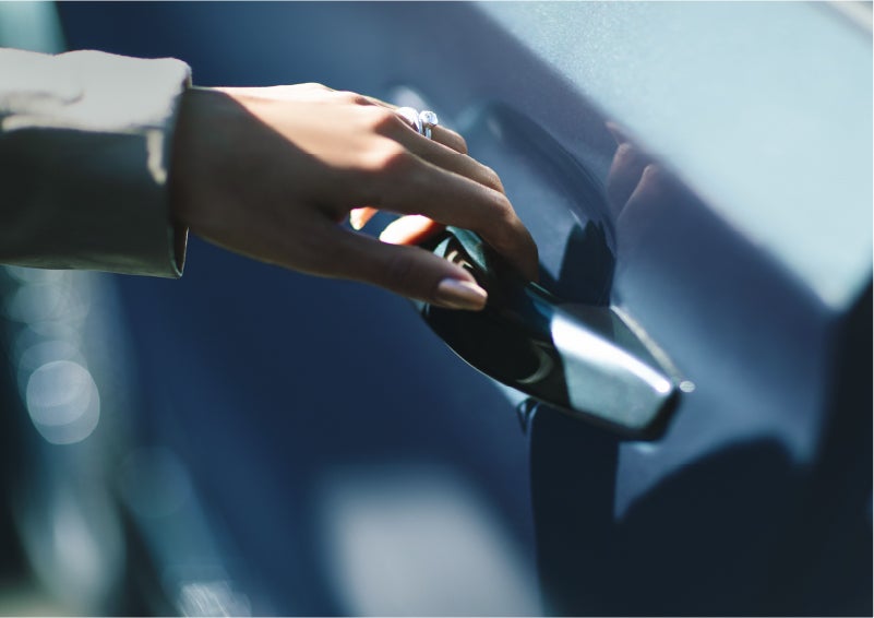 A hand gracefully grips the Light Touch Handle of a 2023 Lincoln Aviator® SUV to demonstrate its ease of use | Koons Lincoln of Bethesda in Silver Spring MD