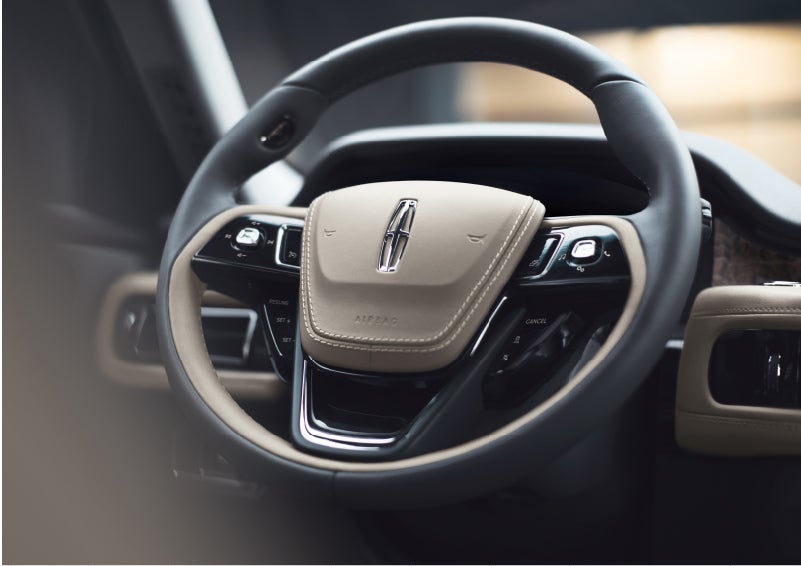 The intuitively placed controls of the steering wheel on a 2023 Lincoln Aviator® SUV | Koons Lincoln of Bethesda in Silver Spring MD