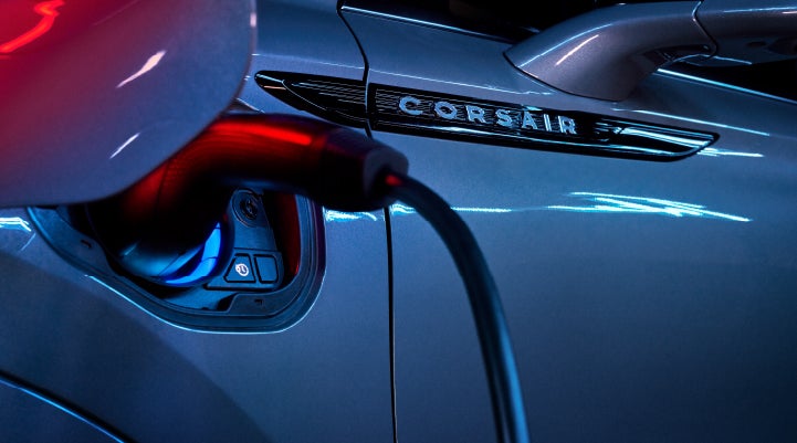 A charger plugged into the charging port of a 2024 Lincoln Corsair® Plug-in Hybrid model. | Koons Lincoln of Bethesda in Silver Spring MD